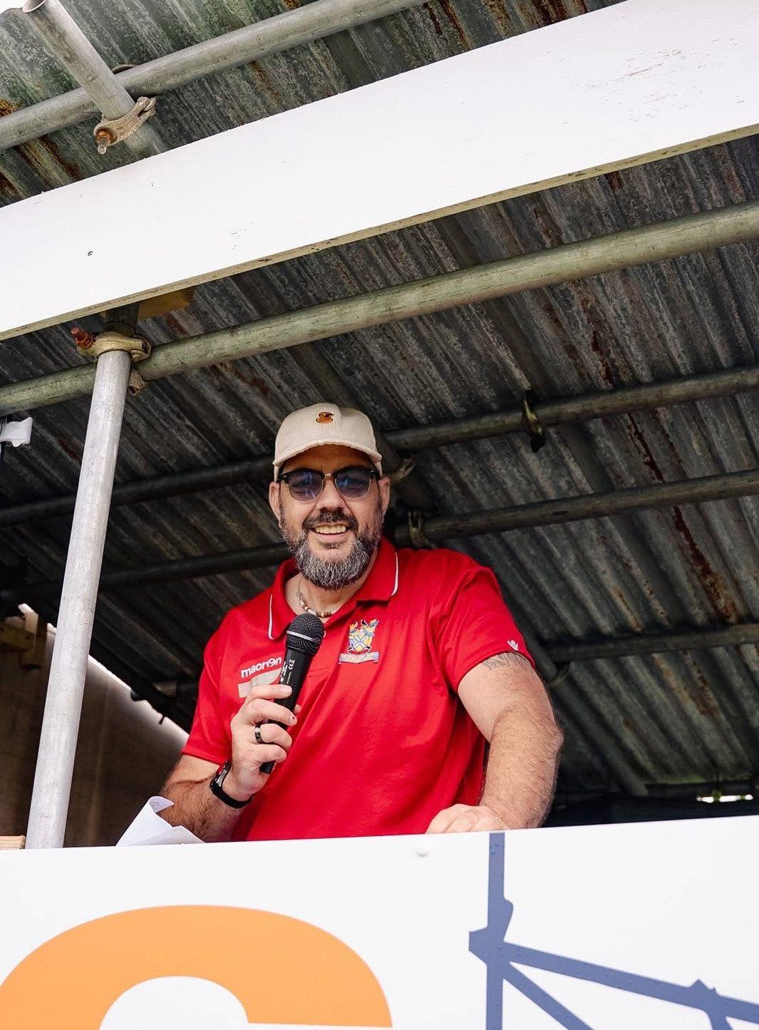 DJ Beaker (Chris Gerry) in the announcer's booth at Mount Wise Stadium